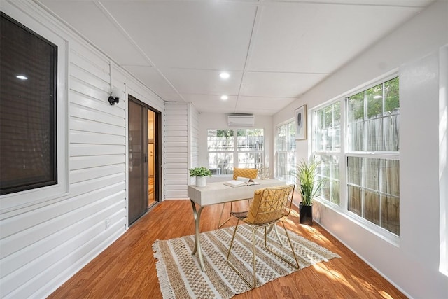12307 Marogot Run, Austin, TX 78758 - sunroom featuring a wall mounted AC, recessed lighting, wood finished floors, and plenty of natural light