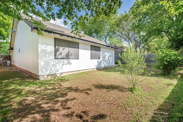 12307 Marogot Run, Austin, TX 78758 - view of property exterior with a central AC unit and roof with shingles