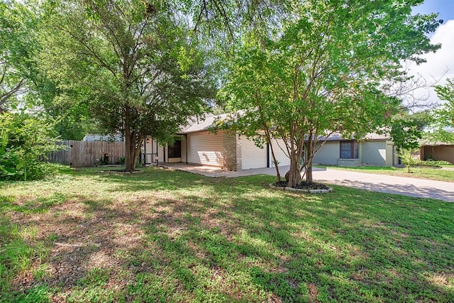 12307 Marogot Run, Austin, TX 78758 - view of front facade featuring an attached garage and driveway