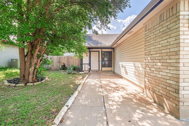 12307 Marogot Run, Austin, TX 78758 - view of exterior entry with a shingled roof