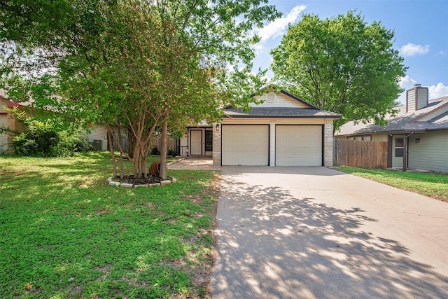12307 Marogot Run, Austin, TX 78758 - view of front of home with driveway, a garage, and brick siding