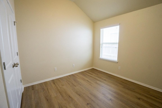 5865 Urbano Bnd, Round Rock, TX 78665 - empty room featuring wood finished floors and vaulted ceiling