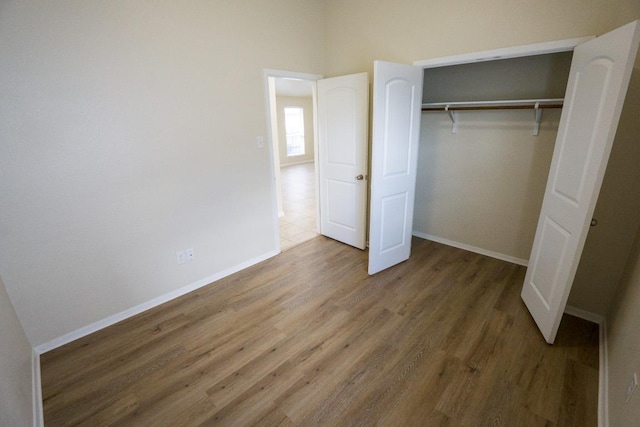 5865 Urbano Bnd, Round Rock, TX 78665 - unfurnished bedroom featuring wood finished floors and a closet