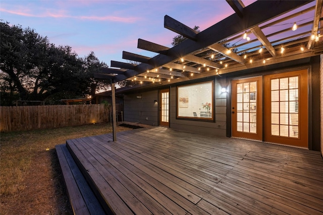 5809 Cherry Creek Dr, Austin, TX 78745 - deck at dusk with french doors and a pergola