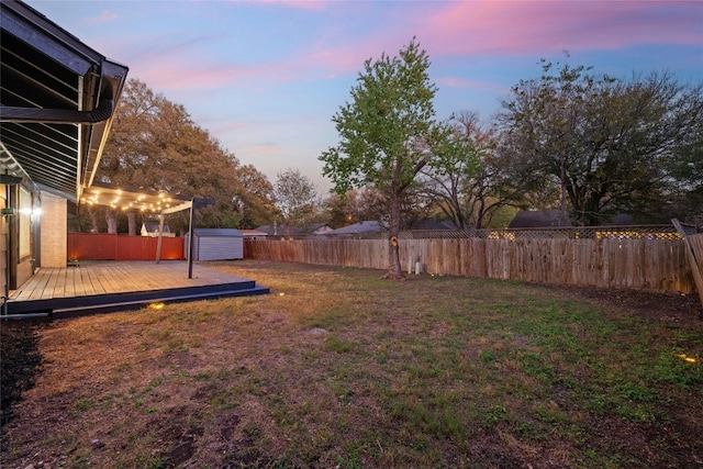 5809 Cherry Creek Dr, Austin, TX 78745 - fenced backyard with a deck and a storage unit