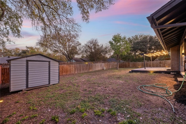 5809 Cherry Creek Dr, Austin, TX 78745 - fenced backyard with a storage unit and a deck