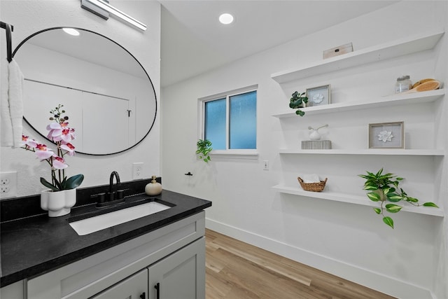 5809 Cherry Creek Dr, Austin, TX 78745 - bathroom featuring vanity, wood finished floors, and recessed lighting