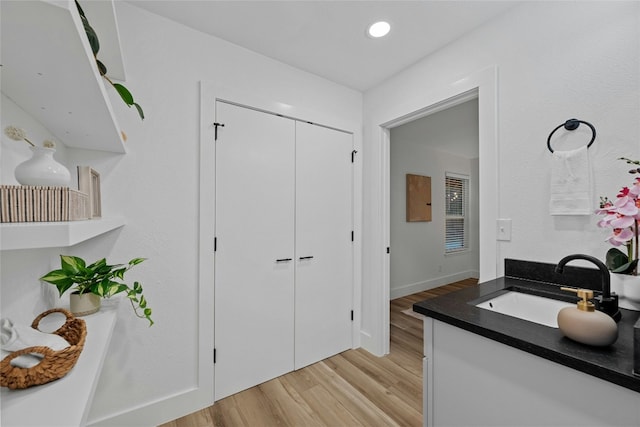 5809 Cherry Creek Dr, Austin, TX 78745 - bathroom with vanity, wood finished floors, and recessed lighting