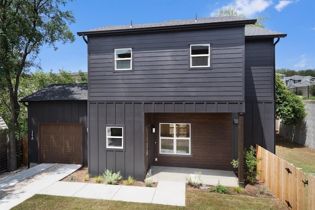 5304 Samuel Huston Ave Unit B, Austin, TX 78721 - traditional-style home featuring board and batten siding, a garage, and roof with shingles