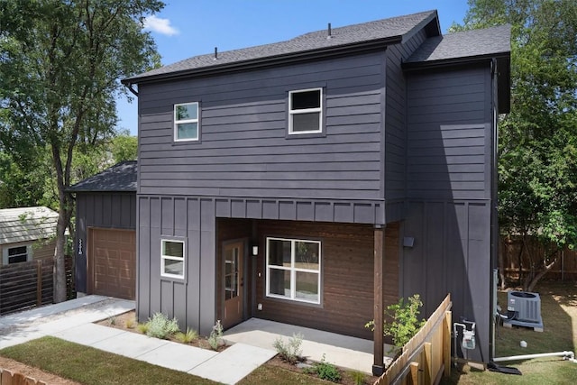 5304 Samuel Huston Ave Unit B, Austin, TX 78721 - view of front of property with board and batten siding, roof with shingles, and an attached garage