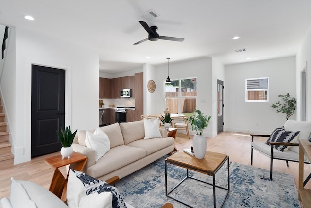 5304 Samuel Huston Ave Unit B, Austin, TX 78721 - living area with light wood finished floors, a ceiling fan, recessed lighting, and stairs