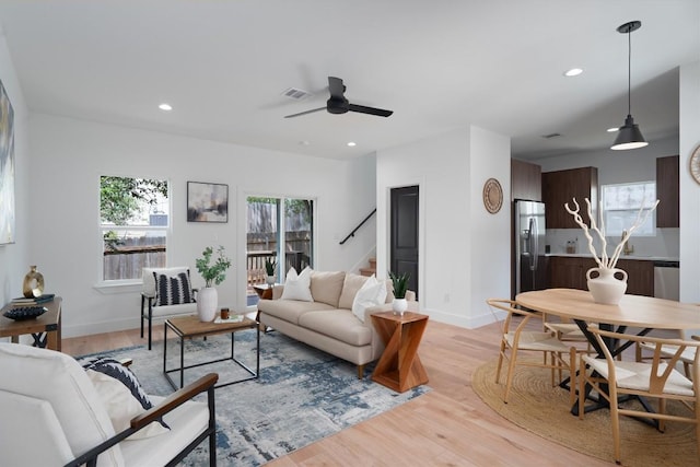 5304 Samuel Huston Ave Unit B, Austin, TX 78721 - living room featuring stairway, ceiling fan, light wood finished floors, and recessed lighting