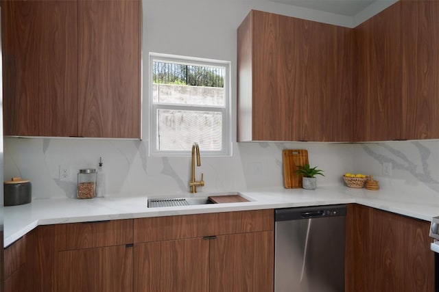 5304 Samuel Huston Ave Unit B, Austin, TX 78721 - kitchen featuring stainless steel dishwasher, modern cabinets, decorative backsplash, and brown cabinets