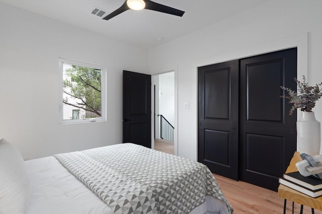 5304 Samuel Huston Ave Unit B, Austin, TX 78721 - bedroom featuring light wood finished floors, a ceiling fan, and a closet