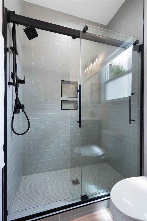 5304 Samuel Huston Ave Unit B, Austin, TX 78721 - full bathroom with a stall shower and toilet