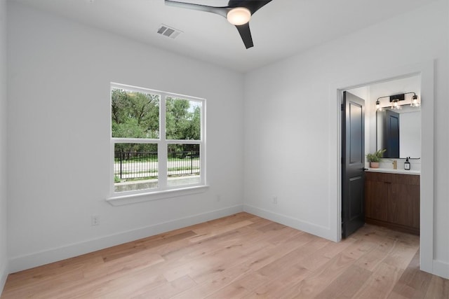 5304 Samuel Huston Ave Unit B, Austin, TX 78721 - unfurnished bedroom with light wood-type flooring, connected bathroom, and a ceiling fan