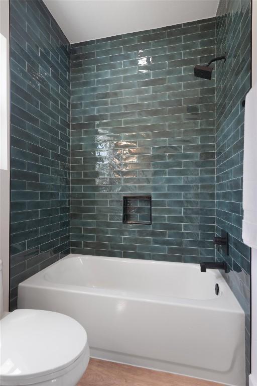 5304 Samuel Huston Ave Unit B, Austin, TX 78721 - bathroom with tub / shower combination and wood finished floors
