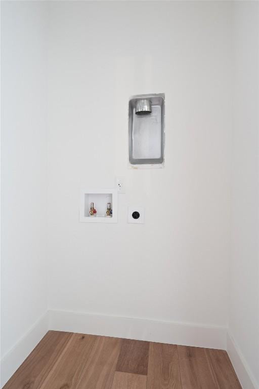 5304 Samuel Huston Ave Unit B, Austin, TX 78721 - washroom with electric dryer hookup, hookup for a washing machine, and wood finished floors