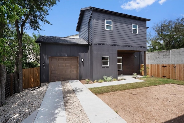 5304 Samuel Huston Ave Unit B, Austin, TX 78721 - contemporary house with board and batten siding, driveway, an attached garage, and a shingled roof