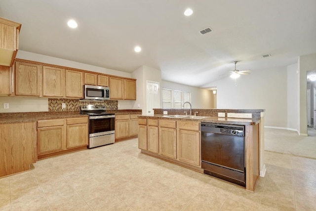 10423 Ancient Anchor, San Antonio, TX 78245 - kitchen with appliances with stainless steel finishes, light brown cabinets, a ceiling fan, an island with sink, and tasteful backsplash
