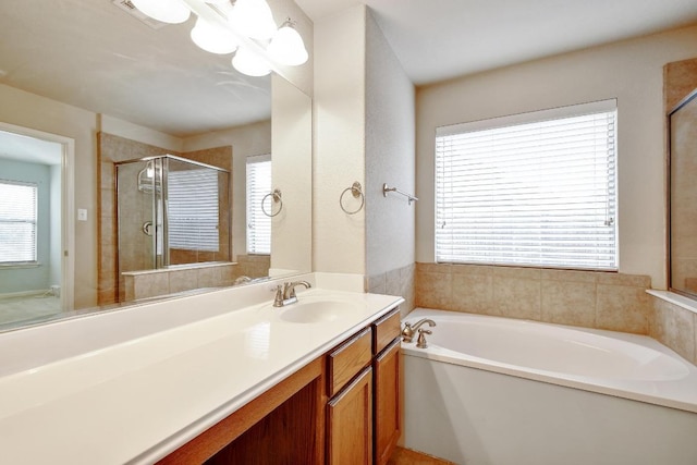 10423 Ancient Anchor, San Antonio, TX 78245 - bathroom featuring a bath, vanity, and a stall shower