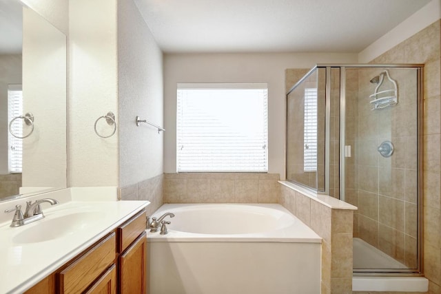 10423 Ancient Anchor, San Antonio, TX 78245 - bathroom featuring a garden tub, vanity, and a stall shower