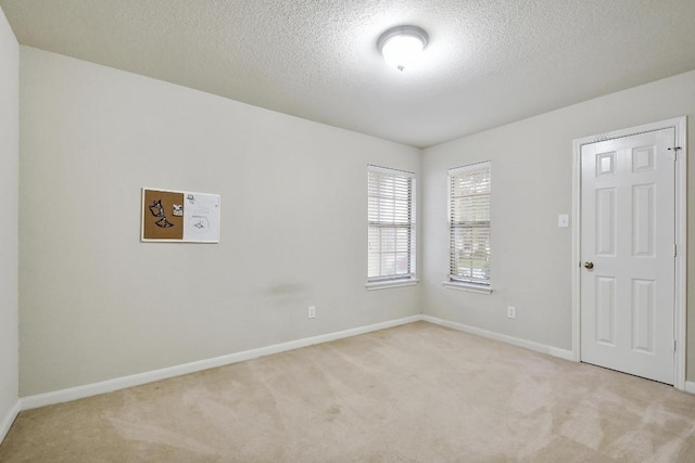 10423 Ancient Anchor, San Antonio, TX 78245 - spare room featuring light carpet and a textured ceiling