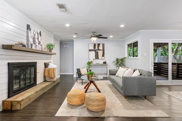 3207 Harpers Ferry Ln, Austin, TX 78745 - living area featuring ornamental molding, ceiling fan, a glass covered fireplace, recessed lighting, and wood finished floors