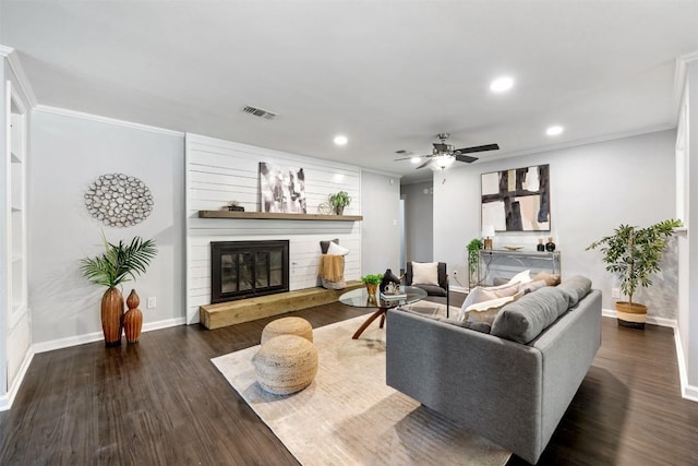 3207 Harpers Ferry Ln, Austin, TX 78745 - living area featuring a glass covered fireplace, recessed lighting, wood finished floors, ceiling fan, and ornamental molding