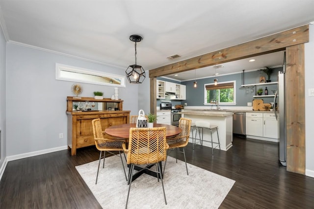3207 Harpers Ferry Ln, Austin, TX 78745 - dining space with crown molding and dark wood-style floors
