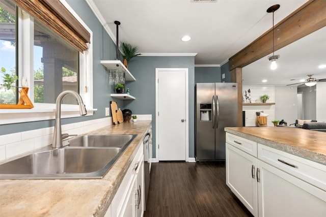 3207 Harpers Ferry Ln, Austin, TX 78745 - kitchen with stainless steel fridge, open shelves, dark wood-style flooring, light countertops, and ornamental molding