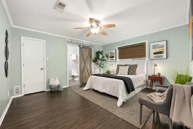 3207 Harpers Ferry Ln, Austin, TX 78745 - bedroom with a barn door, wood finished floors, crown molding, connected bathroom, and ceiling fan
