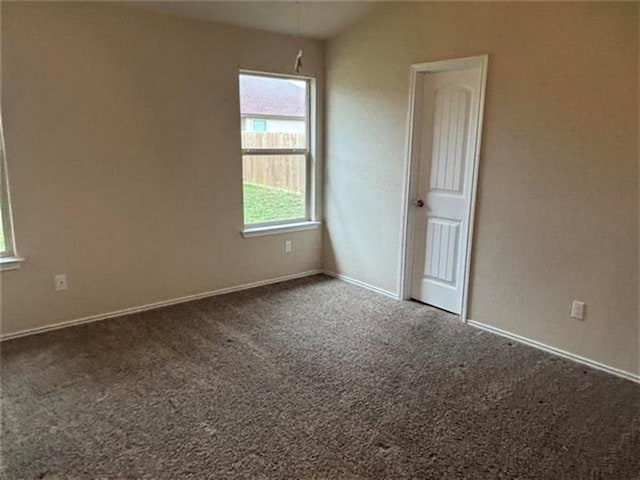 103 Beth Ann Loop, Taylor, TX 76574 - empty room featuring carpet floors and lofted ceiling