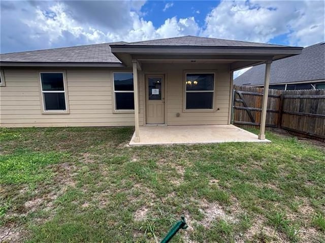 103 Beth Ann Loop, Taylor, TX 76574 - rear view of house with a patio and a fenced backyard