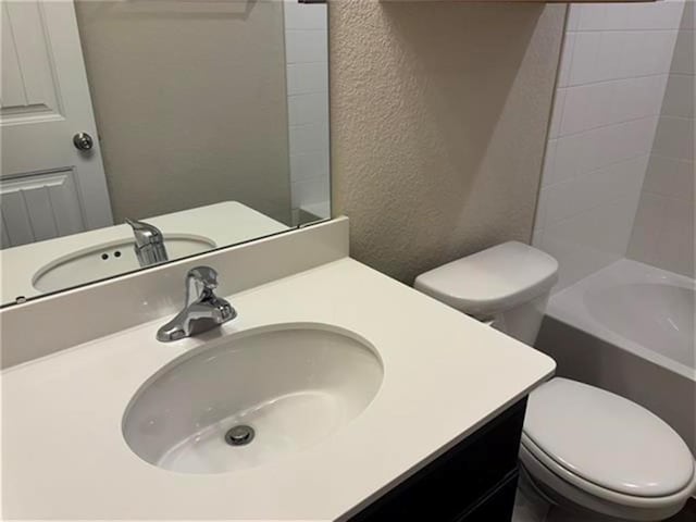 103 Beth Ann Loop, Taylor, TX 76574 - full bathroom featuring a textured wall, vanity, and  shower combination