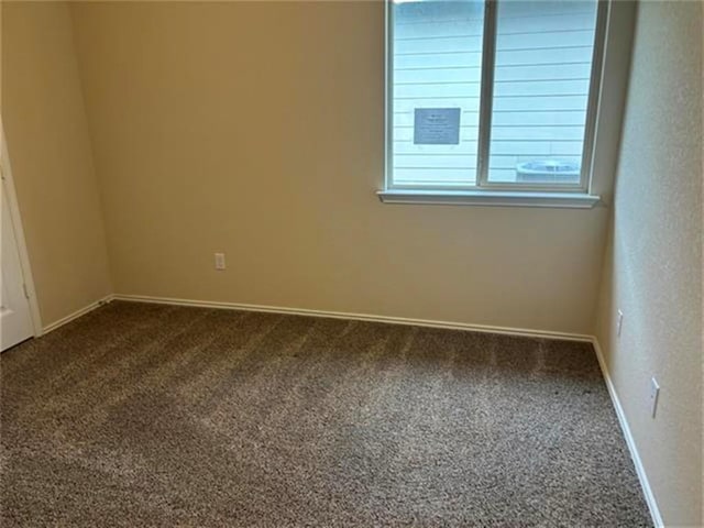 103 Beth Ann Loop, Taylor, TX 76574 - spare room with dark carpet