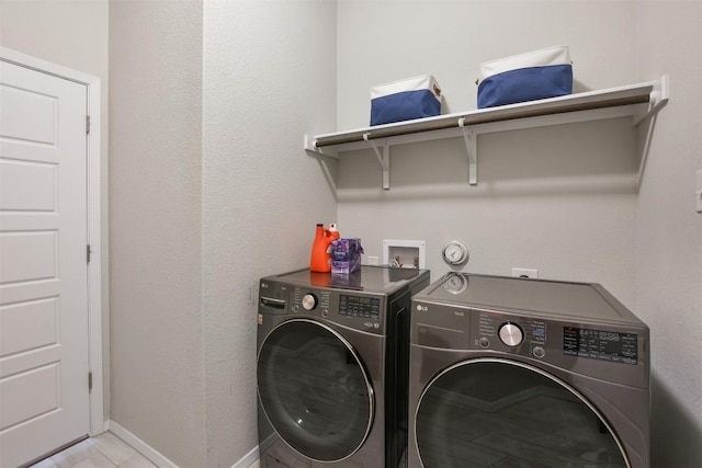 21510 Paine Ave, Lago Vista, TX 78645 - laundry room featuring washing machine and clothes dryer and baseboards