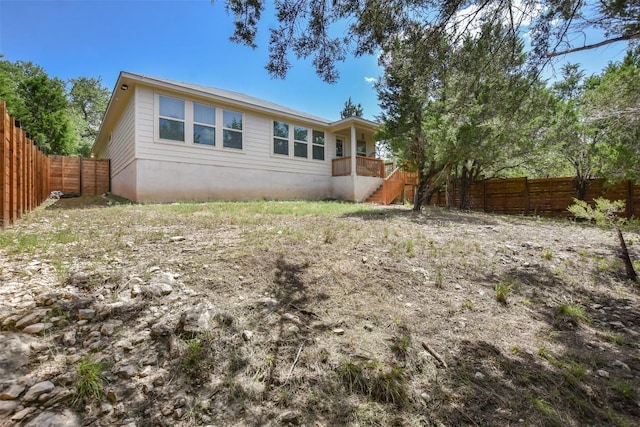 21510 Paine Ave, Lago Vista, TX 78645 - back of house with a fenced backyard and stairway