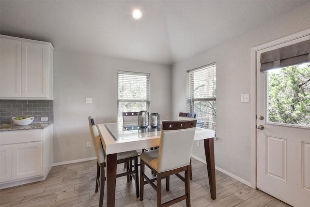 21510 Paine Ave, Lago Vista, TX 78645 - dining area featuring plenty of natural light, light wood-type flooring, and lofted ceiling