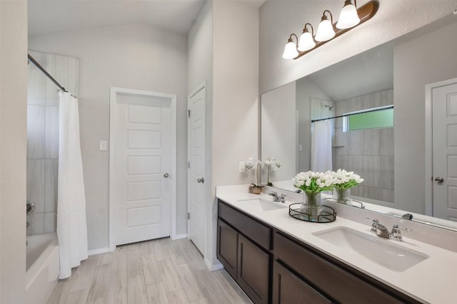 21510 Paine Ave, Lago Vista, TX 78645 - bathroom with vaulted ceiling, double vanity, and shower / bath combo with shower curtain