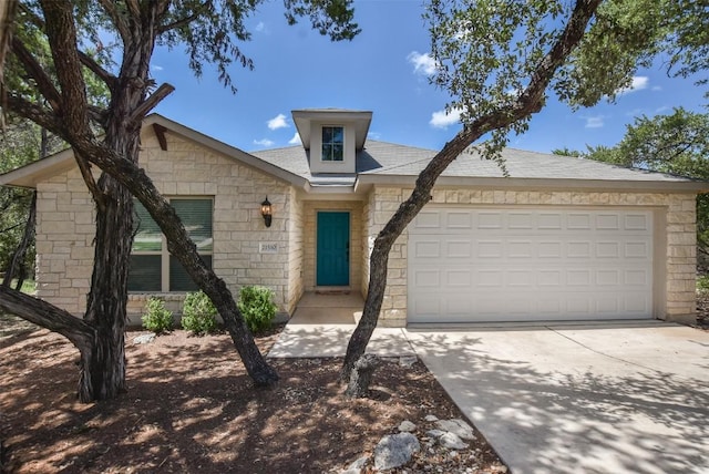 21510 Paine Ave, Lago Vista, TX 78645 - ranch-style home with concrete driveway, a garage, and stone siding