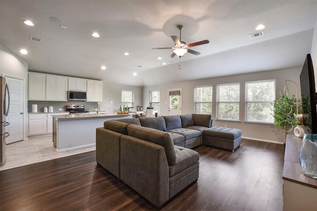 21510 Paine Ave, Lago Vista, TX 78645 - living area featuring a ceiling fan, wood finished floors, vaulted ceiling, and recessed lighting