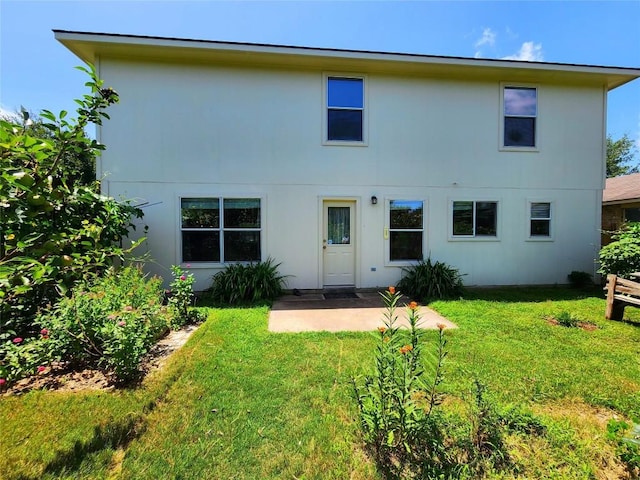 203 Pheasant Trl, Bastrop, TX 78602 - rear view of property with a lawn