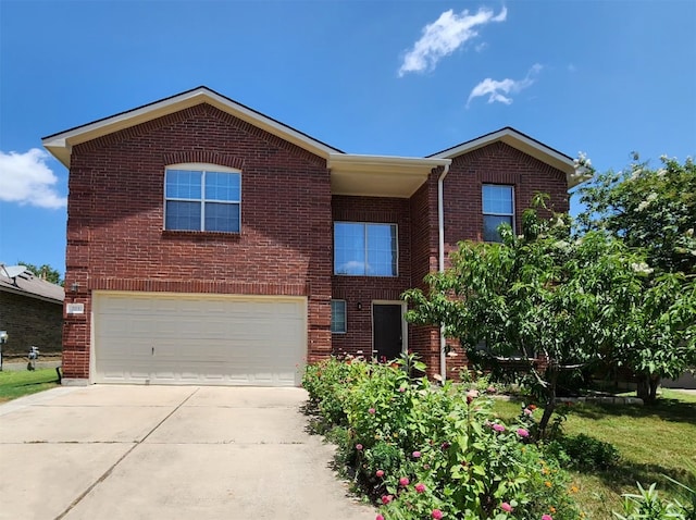203 Pheasant Trl, Bastrop, TX 78602 - traditional-style house with a garage, concrete driveway, and brick siding