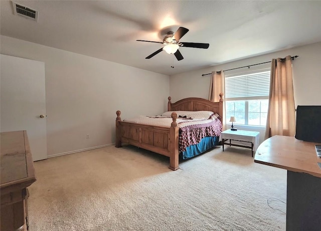 203 Pheasant Trl, Bastrop, TX 78602 - bedroom with light colored carpet and ceiling fan