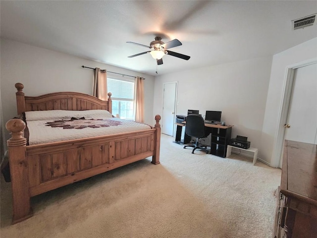 203 Pheasant Trl, Bastrop, TX 78602 - bedroom with light carpet, a desk, and a ceiling fan