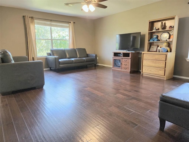 203 Pheasant Trl, Bastrop, TX 78602 - living area with dark wood-style flooring and ceiling fan