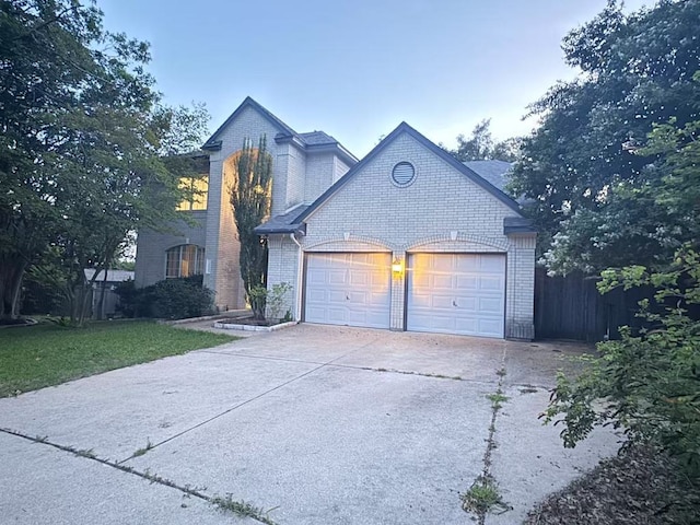 10204 Tenava Ct, Austin, TX 78726 - view of front of home featuring brick siding, driveway, and a garage
