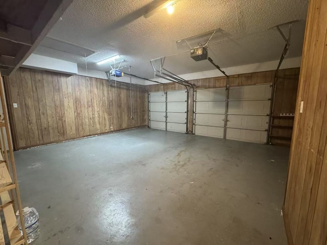 10204 Tenava Ct, Austin, TX 78726 - garage with a garage door opener and wooden walls