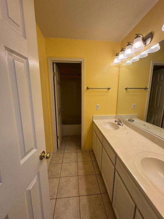 10204 Tenava Ct, Austin, TX 78726 - bathroom with double vanity and tile patterned floors